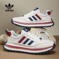 Biele tenisky adidas s retro štýlom a farebnými pruhmi